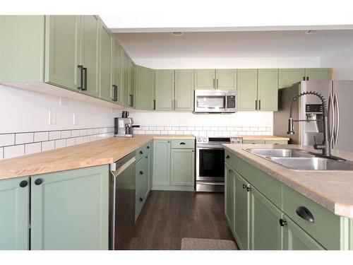 23-97 Wilson Drive, Fort Mcmurray, AB - Indoor Photo Showing Kitchen With Stainless Steel Kitchen With Double Sink