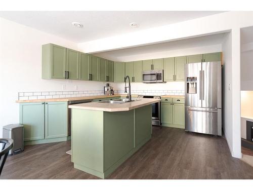 23-97 Wilson Drive, Fort Mcmurray, AB - Indoor Photo Showing Kitchen With Stainless Steel Kitchen With Double Sink