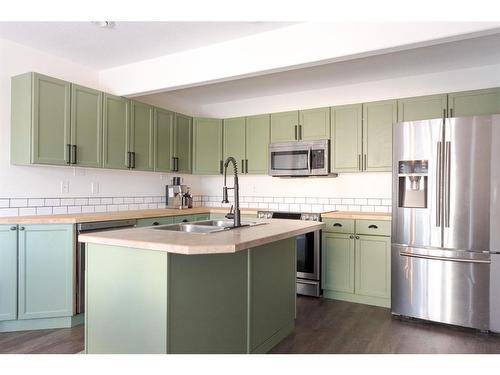 23-97 Wilson Drive, Fort Mcmurray, AB - Indoor Photo Showing Kitchen With Stainless Steel Kitchen With Double Sink