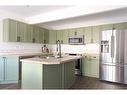 23-97 Wilson Drive, Fort Mcmurray, AB  - Indoor Photo Showing Kitchen With Stainless Steel Kitchen With Double Sink 