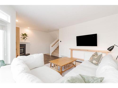 23-97 Wilson Drive, Fort Mcmurray, AB - Indoor Photo Showing Living Room With Fireplace