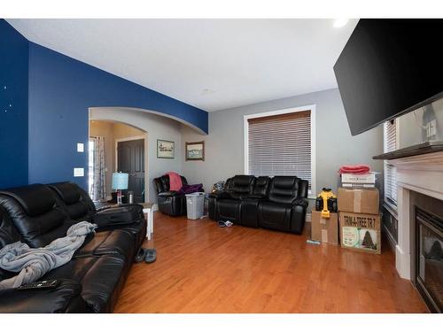 133 Sandhill Place, Fort Mcmurray, AB - Indoor Photo Showing Living Room With Fireplace