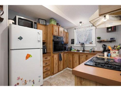 252 Caouette Crescent, Fort Mcmurray, AB - Indoor Photo Showing Kitchen