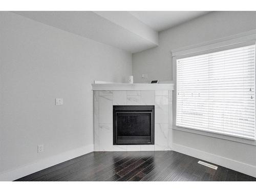 244 Shalestone Way Nw, Fort Mcmurray, AB - Indoor Photo Showing Living Room With Fireplace