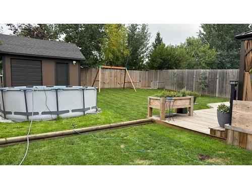 223 Dickins Drive, Fort Mcmurray, AB - Outdoor With Above Ground Pool With Backyard