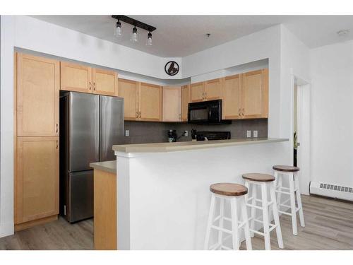 203-100 Denholm Gate, Fort Mcmurray, AB - Indoor Photo Showing Kitchen