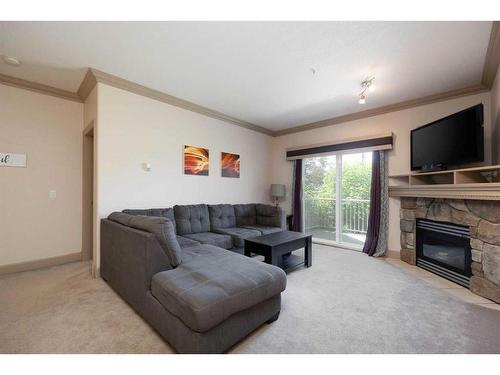 102-9918 Gordon Avenue, Fort Mcmurray, AB - Indoor Photo Showing Living Room With Fireplace