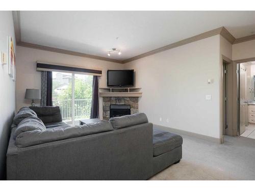 102-9918 Gordon Avenue, Fort Mcmurray, AB - Indoor Photo Showing Living Room With Fireplace