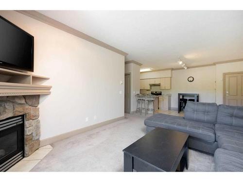 102-9918 Gordon Avenue, Fort Mcmurray, AB - Indoor Photo Showing Living Room With Fireplace