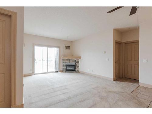 302-9918 Gordon Avenue, Fort Mcmurray, AB - Indoor Photo Showing Living Room With Fireplace