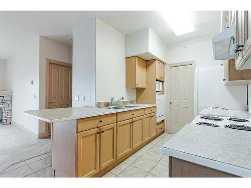 302-9918 Gordon Avenue, Fort Mcmurray, AB - Indoor Photo Showing Kitchen With Double Sink