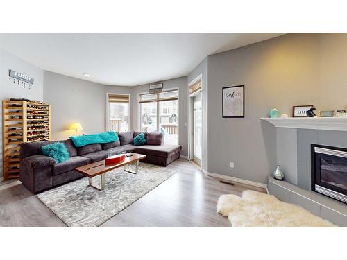 58-97 Wilson Drive, Fort Mcmurray, AB - Indoor Photo Showing Living Room With Fireplace