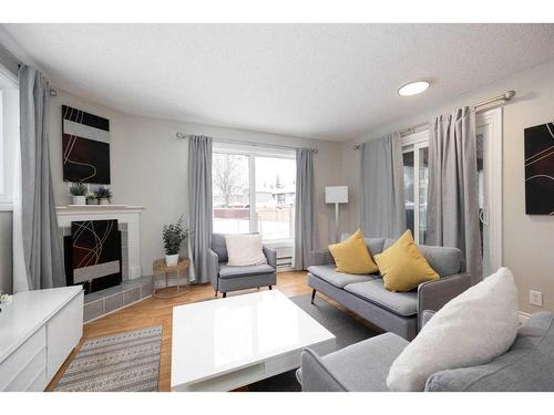 110 Ross Street, Fort Mcmurray, AB - Indoor Photo Showing Living Room With Fireplace