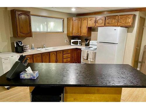 10024 103 Avenue, Lac La Biche, AB - Indoor Photo Showing Kitchen With Double Sink