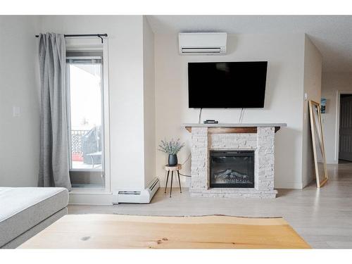 2115-204 Sparrow Hawk Drive, Fort Mcmurray, AB - Indoor Photo Showing Living Room With Fireplace