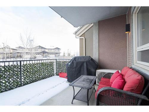 2115-204 Sparrow Hawk Drive, Fort Mcmurray, AB - Indoor Photo Showing Living Room With Fireplace