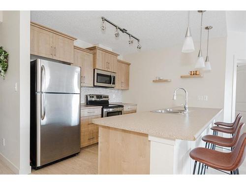 2115-204 Sparrow Hawk Drive, Fort Mcmurray, AB - Indoor Photo Showing Kitchen With Stainless Steel Kitchen With Double Sink With Upgraded Kitchen