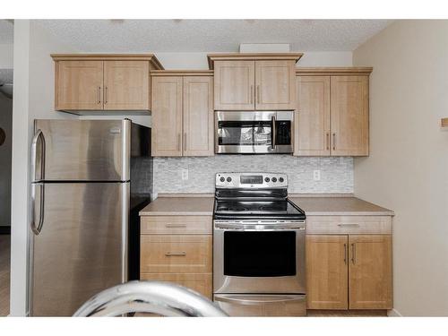 2115-204 Sparrow Hawk Drive, Fort Mcmurray, AB - Indoor Photo Showing Kitchen With Stainless Steel Kitchen