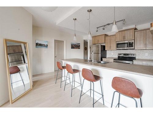 2115-204 Sparrow Hawk Drive, Fort Mcmurray, AB - Indoor Photo Showing Kitchen With Stainless Steel Kitchen With Double Sink