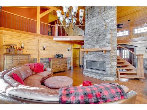 173 Sommer Way, Saprae Creek, AB - Indoor Photo Showing Living Room With Fireplace