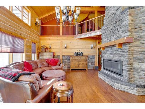 173 Sommer Way, Saprae Creek, AB - Indoor Photo Showing Living Room With Fireplace