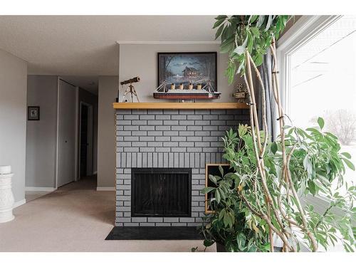 125 Silvertip Place, Fort Mcmurray, AB - Indoor Photo Showing Living Room With Fireplace