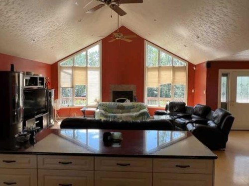 158 Poplar Drive Rr, Conklin, AB - Indoor Photo Showing Living Room With Fireplace
