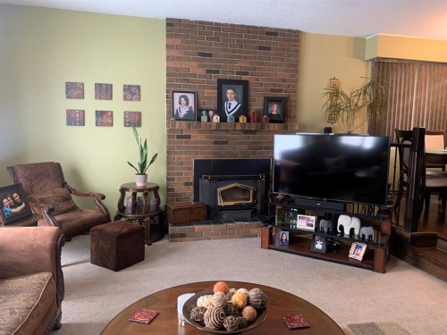 10016 102 Avenue, Lac La Biche, AB - Indoor Photo Showing Living Room With Fireplace