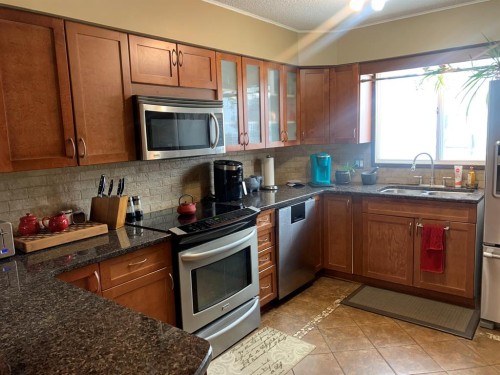10016 102 Avenue, Lac La Biche, AB - Indoor Photo Showing Kitchen With Double Sink