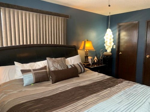 10016 102 Avenue, Lac La Biche, AB - Indoor Photo Showing Bedroom