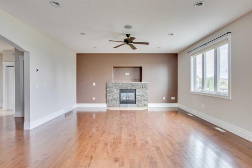 404 Killdeer Way, Fort Mcmurray, AB - Indoor Photo Showing Living Room With Fireplace