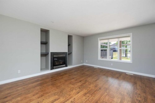 103 Rattlepan Creek Crescent, Fort Mcmurray, AB - Indoor Photo Showing Living Room With Fireplace