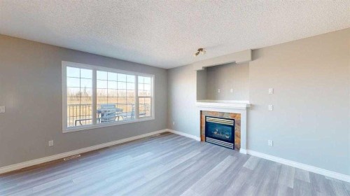 334 Grosbeak Way, Fort Mcmurray, AB - Indoor Photo Showing Living Room With Fireplace