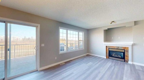 334 Grosbeak Way, Fort Mcmurray, AB - Indoor Photo Showing Living Room With Fireplace