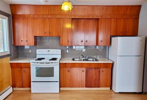 66 Lakeview, Lac La Biche, AB - Indoor Photo Showing Kitchen With Double Sink