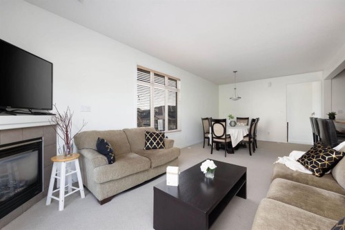 5-105 Fontaine Crescent, Fort Mcmurray, AB - Indoor Photo Showing Living Room With Fireplace
