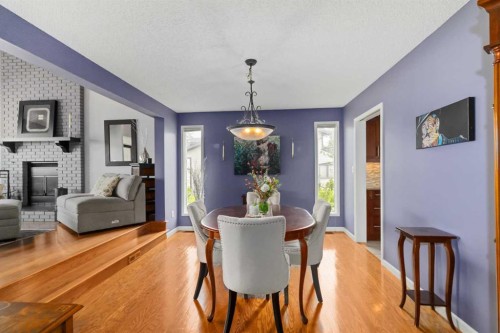 145 Burns Place, Fort Mcmurray, AB - Indoor Photo Showing Dining Room With Fireplace