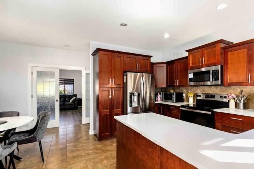 128 Juniper Street, Fort Mcmurray, AB - Indoor Photo Showing Kitchen With Stainless Steel Kitchen