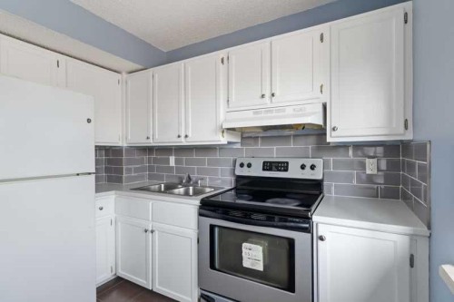 151C Dickins Drive, Fort Mcmurray, AB - Indoor Photo Showing Kitchen With Double Sink