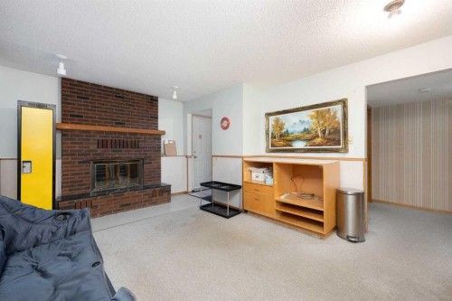 206 Leigh Crescent, Fort Mcmurray, AB - Indoor Photo Showing Living Room With Fireplace