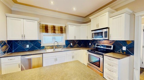 149 Juniper Street, Fort Mcmurray, AB - Indoor Photo Showing Kitchen With Stainless Steel Kitchen