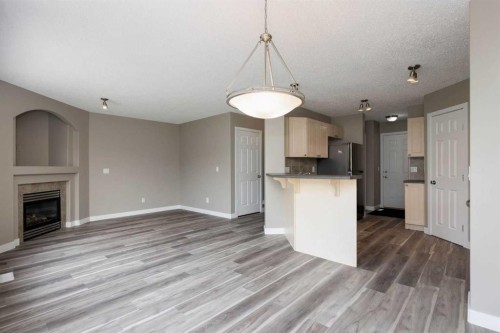 164 Cinnamon Street, Fort Mcmurray, AB - Indoor Photo Showing Kitchen With Fireplace