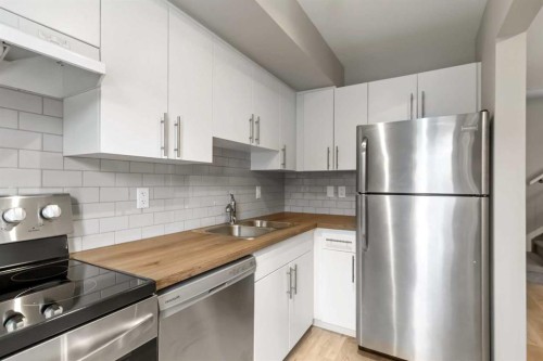 712-201 Abasand Drive, Fort Mcmurray, AB - Indoor Photo Showing Kitchen With Stainless Steel Kitchen With Double Sink