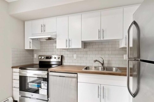 712-201 Abasand Drive, Fort Mcmurray, AB - Indoor Photo Showing Kitchen With Stainless Steel Kitchen With Double Sink