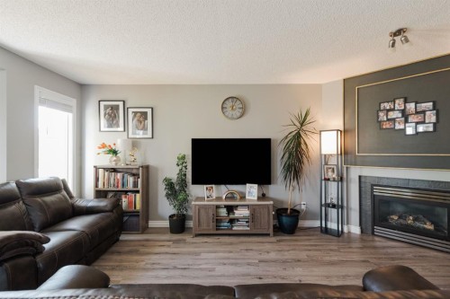216 Coyote Crescent, Fort Mcmurray, AB - Indoor Photo Showing Living Room With Fireplace