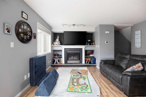 7-220 Swanson Crescent, Fort Mcmurray, AB - Indoor Photo Showing Living Room With Fireplace