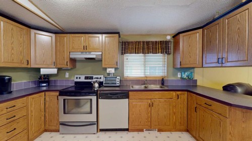 152 Cree Road, Fort Mcmurray, AB - Indoor Photo Showing Kitchen With Double Sink