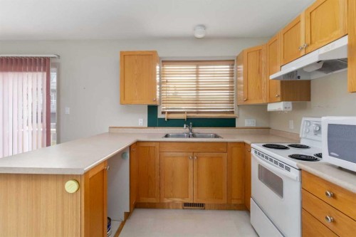 130 Athabasca Place, Fort Mcmurray, AB - Indoor Photo Showing Kitchen With Double Sink