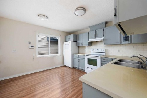 238 Windsor Drive, Fort Mcmurray, AB - Indoor Photo Showing Kitchen With Double Sink