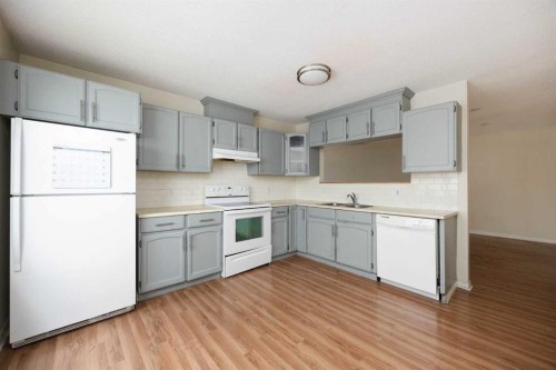 238 Windsor Drive, Fort Mcmurray, AB - Indoor Photo Showing Kitchen With Double Sink